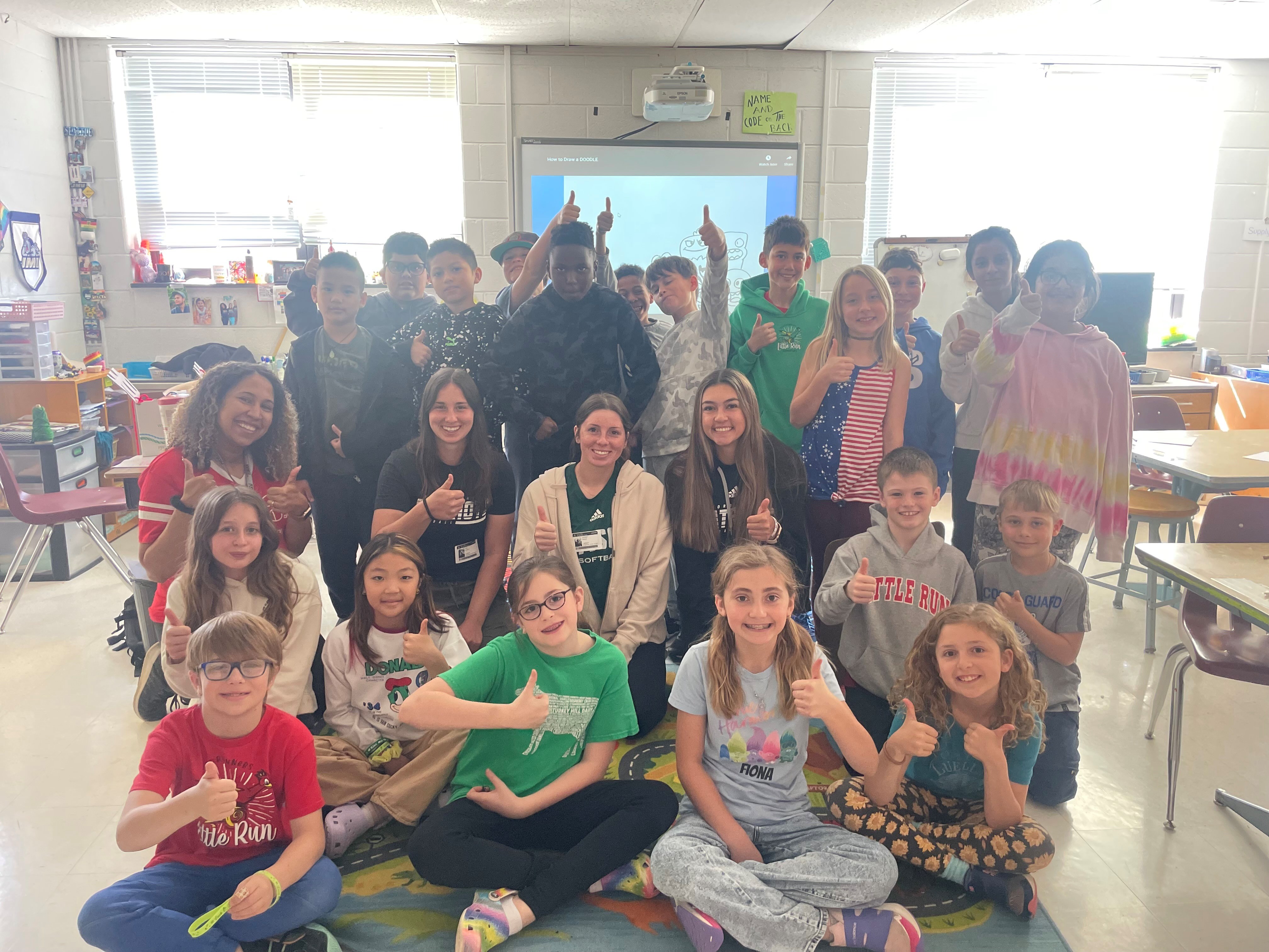 George Mason Softball team with students