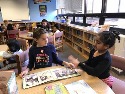 photo of reading together in the library